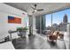 Modern office space with an American flag, hardwood floors, and skyline views at 860 Peachtree Ne St # 1502, Atlanta, GA 30308
