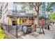 Inviting storefront with outdoor seating, vibrant signage, and appealing urban setting at 860 Peachtree Ne St # 1502, Atlanta, GA 30308