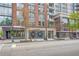 A bustling commercial street featuring various shops and restaurants at 860 Peachtree Ne St # 1502, Atlanta, GA 30308