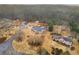 Aerial view of homes featuring large yards, a private driveway, and mature trees at 6069 Shallow Wood Ln, Douglasville, GA 30135