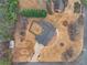 Overhead view of home with an elongated driveway and a large backyard space at 6069 Shallow Wood Ln, Douglasville, GA 30135