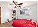 Bedroom with red comforter on bed, and a closet at 6069 Shallow Wood Ln, Douglasville, GA 30135