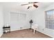 Bedroom with neutral carpet, white walls, fan, and natural light at 6069 Shallow Wood Ln, Douglasville, GA 30135