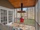 Enjoy outdoor cooking on the screened porch with red grill, perfect for entertaining and relaxing at 1080 Bailiff Ne Ct, Brookhaven, GA 30319