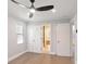 Bedroom features white closet doors and an open door to the en suite bathroom at 127 Marona Ne St, Atlanta, GA 30307