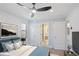 The bedroom features a ceiling fan, blue accents, and access to a bathroom at 127 Marona Ne St, Atlanta, GA 30307