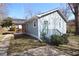 Charming exterior view showcasing the home's light blue siding, well-maintained lawn, and inviting front porch at 127 Marona Ne St, Atlanta, GA 30307