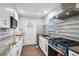 Updated kitchen featuring stainless steel appliances, sleek countertops, and modern cabinetry at 127 Marona Ne St, Atlanta, GA 30307