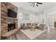 Inviting living room features a stone fireplace and modern decor at 1945 Millers Path, Cumming, GA 30041