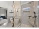 This main bathroom features a soaking tub, a glass shower, and gray-tiled walls at 1945 Millers Path, Cumming, GA 30041