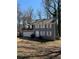 Charming two-story home featuring a gray exterior, white trim, and an attached two-car garage at 641 Spring Forest Dr, Lawrenceville, GA 30043
