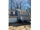 Close up of a charming two-story home featuring a gray exterior, white trim, and an attached garage at 641 Spring Forest Dr, Lawrenceville, GA 30043