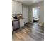 Clean kitchen featuring white cabinets, granite countertops, and stainless steel dishwasher at 641 Spring Forest Dr, Lawrenceville, GA 30043