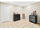 Finished basement area with a wet bar, wine storage, and tile flooring, ideal for hosting gatherings at 105 Kinross Ct, Roswell, GA 30076