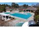 Community pool includes wading pool, lap pool, and waterslide with ample space for relaxation at 105 Kinross Ct, Roswell, GA 30076