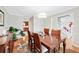 Dining room with a large wooden table and adjacent staircase at 105 Kinross Ct, Roswell, GA 30076
