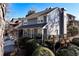 Attractive home with a covered porch, a wooden deck, and mature landscaping creating an inviting and picturesque setting at 105 Kinross Ct, Roswell, GA 30076