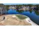 Scenic golf course with lush green, sand traps, and lake views surrounded by beautiful homes at 105 Kinross Ct, Roswell, GA 30076