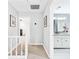 Upstairs hallway leading to a full bathroom and other rooms at 105 Kinross Ct, Roswell, GA 30076