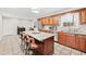 Spacious kitchen with granite island, stainless steel appliances, and ample cabinet space, great for entertaining at 105 Kinross Ct, Roswell, GA 30076