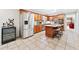 Spacious kitchen featuring stainless steel appliances, granite countertops, and a wine cooler at 105 Kinross Ct, Roswell, GA 30076