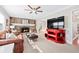 Spacious living room featuring a stone fireplace, neutral carpet, and access to an outdoor patio at 105 Kinross Ct, Roswell, GA 30076