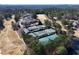 Aerial view of community tennis courts with mature trees at 105 Kinross Ct, Roswell, GA 30076