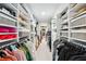 Well-organized walk-in closet with ample shelving and hanging space at 105 Kinross Ct, Roswell, GA 30076