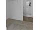 Modern bathroom with a glass shower, white tile, and gray flooring at 484 Hammons Way, Atlanta, GA 30315