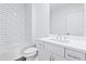 Sleek bathroom featuring white subway tile, modern vanity, and a shower-tub combo at 484 Hammons Way, Atlanta, GA 30315