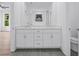 Elegant bathroom features a double sink vanity with quartz countertops and modern fixtures at 484 Hammons Way, Atlanta, GA 30315