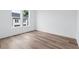 Sunlit bedroom featuring gleaming hardwood floors and double windows at 484 Hammons Way, Atlanta, GA 30315