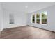 Bright bedroom with hardwood floors, modern window, and abundant natural light at 484 Hammons Way, Atlanta, GA 30315