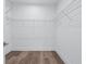 Functional walk-in closet with wire shelving and hardwood flooring at 484 Hammons Way, Atlanta, GA 30315