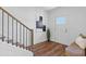 Inviting entryway with hardwood floors, a staircase, and a stylish bench at 484 Hammons Way, Atlanta, GA 30315