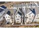 Aerial view of newly constructed townhomes with similar architectural design and landscaping at 484 Hammons Way, Atlanta, GA 30315