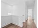 Hallway showcasing sleek wood flooring and crisp, white walls at 484 Hammons Way, Atlanta, GA 30315