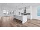 Open-concept kitchen features a large island, stainless steel appliances, and modern finishes at 484 Hammons Way, Atlanta, GA 30315