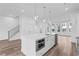 Modern kitchen boasts a large island with a built-in microwave, stainless appliances, and sleek finishes at 484 Hammons Way, Atlanta, GA 30315