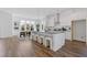 Spacious kitchen featuring a large island with seating and modern pendant lighting at 484 Hammons Way, Atlanta, GA 30315