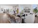 Open concept living room and kitchen area featuring hardwood floors and a modern fireplace at 484 Hammons Way, Atlanta, GA 30315