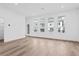 Spacious living room featuring pristine white walls and hardwood flooring throughout at 484 Hammons Way, Atlanta, GA 30315