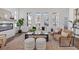 Bright living room with modern fireplace, hardwood floors, multiple windows and stylish neutral decor at 484 Hammons Way, Atlanta, GA 30315