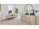 Bright living room with cozy seating, modern cabinet, and round mirror at 484 Hammons Way, Atlanta, GA 30315