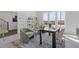 Bright home office featuring a large window, light grey paint and decor, and modern rug at 484 Hammons Way, Atlanta, GA 30315