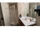 Clean bathroom featuring a shower, modern sink, and vanity with ample countertop space at 637 Outlook Way, Atlanta, GA 30349