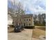 Inviting townhome with neutral siding, well-manicured landscaping, and a private driveway at 637 Outlook Way, Atlanta, GA 30349