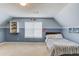 Angled bedroom featuring a large window, carpet, and unique wall art at 2094 Green Gate Pl, Grayson, GA 30017