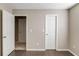 Neutral bedroom with hardwood floors, showing white doors and trim at 2094 Green Gate Pl, Grayson, GA 30017