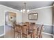 Inviting dining area with stylish lighting and views into the adjacent modern kitchen at 2094 Green Gate Pl, Grayson, GA 30017